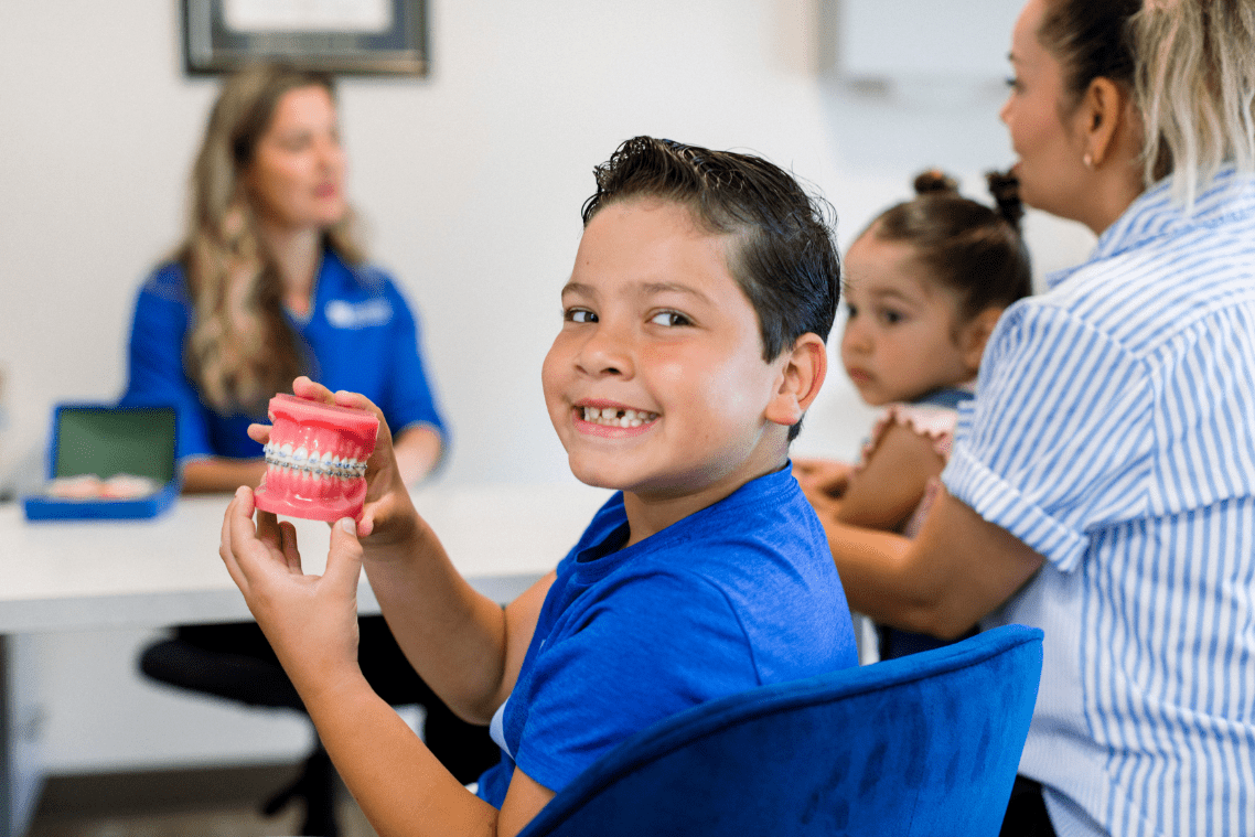 young patient smiling wearing braces